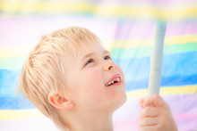 Enjoy Under The Parasol / Cute Child Boy At School Age With Missing Milk Tooth Smiling Under Pastel Colored Sunshade Umbrella