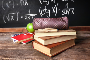 Poster - School books on desk near chalkboard