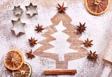 Fototapeta Panele - Christmas tree made from flour on desk, ingredients for baking a