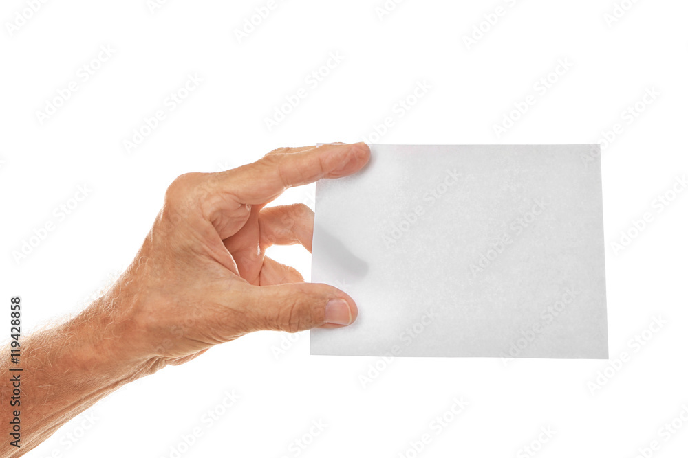 Old man hand holding sheet of paper on a white background