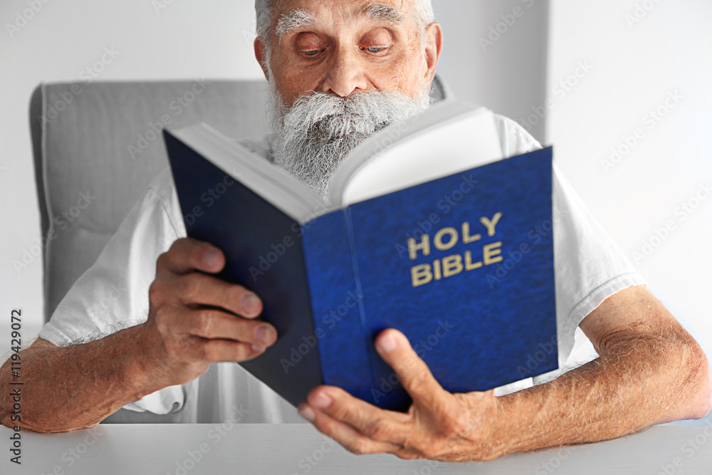 Old man reading the Bible