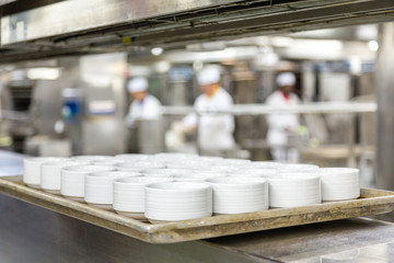 Wall Mural - White Soup Bowls with Chefs in Background