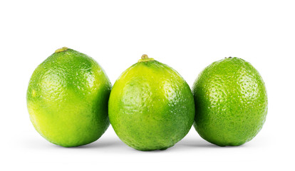 Wall Mural - three limes isolated on white background close up