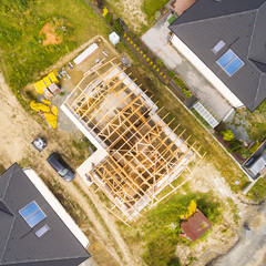 Sticker - Construction site of new family house. Aerial view of area for pleasant living in suburban district. Construction industry from above.