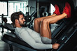 © sasamihajlovic - Man focused on training legs on the machine