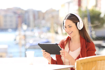 Wall Mural - Woman watching media content in a tablet