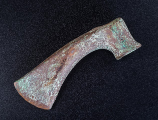 Prehistoric bronze ax, the ancients, isolated on black backgroun