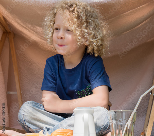 Little Boy With Curly Blond Hair Outside Buy This Stock Photo