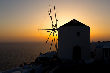 Wall Mural - Old windmill at sunset, Santorini