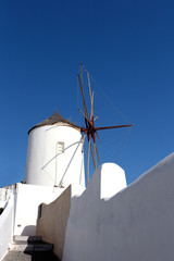 Wall Mural - Windmill of Oia town at sunny day, Santorini