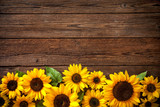 Sunflowers on wooden background