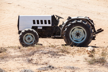 Wall Mural - Empty gray tractor with black details, side view