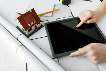 Poster - close up of hand with blueprint and tablet pc