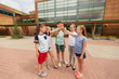 © Syda Productions - group of children making high five at school yard