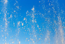 Water Splashing From The Fountain In The Background Of Blue Sky