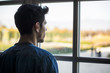 © theartofphoto - Half Body Shot of a Thoughtful Handsome Young Man Looking Away out of Window, Inside Historic Building in European City