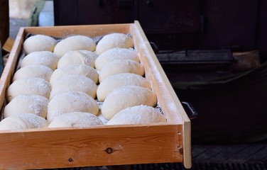 Wall Mural - Raw bread loaves on wooden board