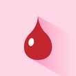 © imaagio.stock - Icono de una gota de sangre sobre fondo rosa