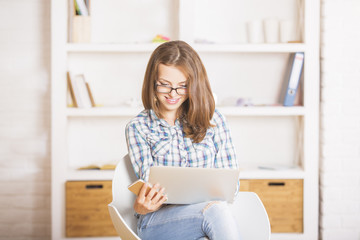 Wall Mural - Woman with laptop and smartphone