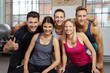 © contrastwerkstatt - lachendes team im fitnessstudio zeigt daumen hoch