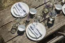 Overhead View Of Crockery And Silverware On Table