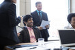 © Cavan Images - Business people talking during meeting in office
