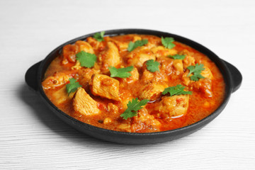 Sticker - Chicken curry on wooden background