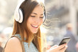 Happy girl listening music with headphones