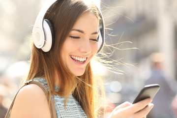 Sticker - Happy girl listening music with headphones