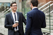 © Sergey Nivens - Two businessmen talking outdoors