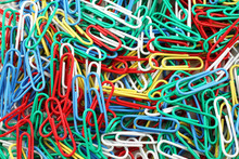 A Close Up Image Of Multicolored Paper Clips