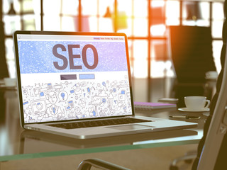 Wall Mural - seo on laptop in workplace background. 3d illustration.