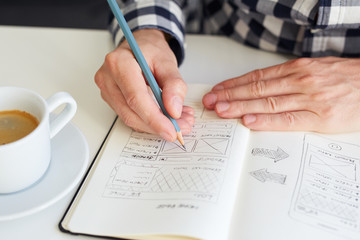 Wall Mural - man draws a sketch for website