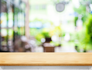 Aufkleber - Empty beige color wood table and blurred garden cafe light backg
