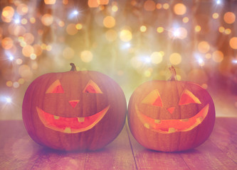 close up of carved halloween pumpkins on table