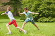 © Syda Productions - happy kids running and playing game outdoors