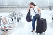 © Song_about_summer - stressed troubled woman in the airport with plenty of bags and luggage