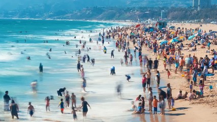 Wall Mural - Time-lapse of people and waves at the Santa Monica, CA shoreline