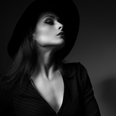 Glamour sexy makeup woman profile posing in fashion hat on dark