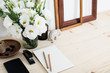 White contemporary feminine work desk with flowers