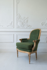 Wall Mural - One classic armchair against a white wall and floor. Copy space