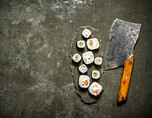 Poster - Japanese rolls with a hatchet for cutting.