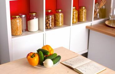 Wall Mural - Pile of organic vegetables on a rustic wooden table