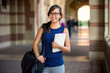 Portrait of a beautiful female college student on campus during day cheerful bright attractive