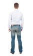© ghoststone - Back view of man in jeans. Standing young guy. Rear view people collection.  backside view of person.  Isolated over white background. Business man in shirt and jeans is looking ahead.