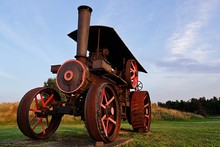 Huge Agricultural Steam Tractor With Steel Wheels Displayed In Museum.
