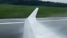 POLAND 2016: A Plane Is Taxxiing On A Runway Until It Comes To A Complete Stop. The Plane Stops Moving. Close-up Shot.
