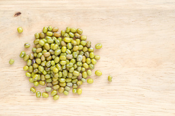 Wall Mural - raw mung beans on wooden background.
