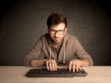 Fototapeta Tęcza - Computer geek typing on keyboard