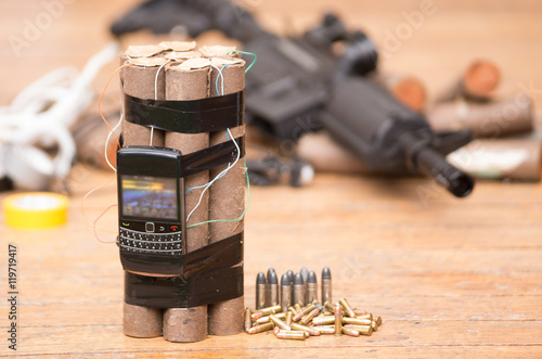 Fotografía Homemade bomb with explosives and cellular phone attached wires sitting next to